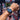 Person wearing a blue watch at a triathlon event with a crowd in the background