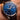 Luxury watch with blue dial and brown leather strap on wrist