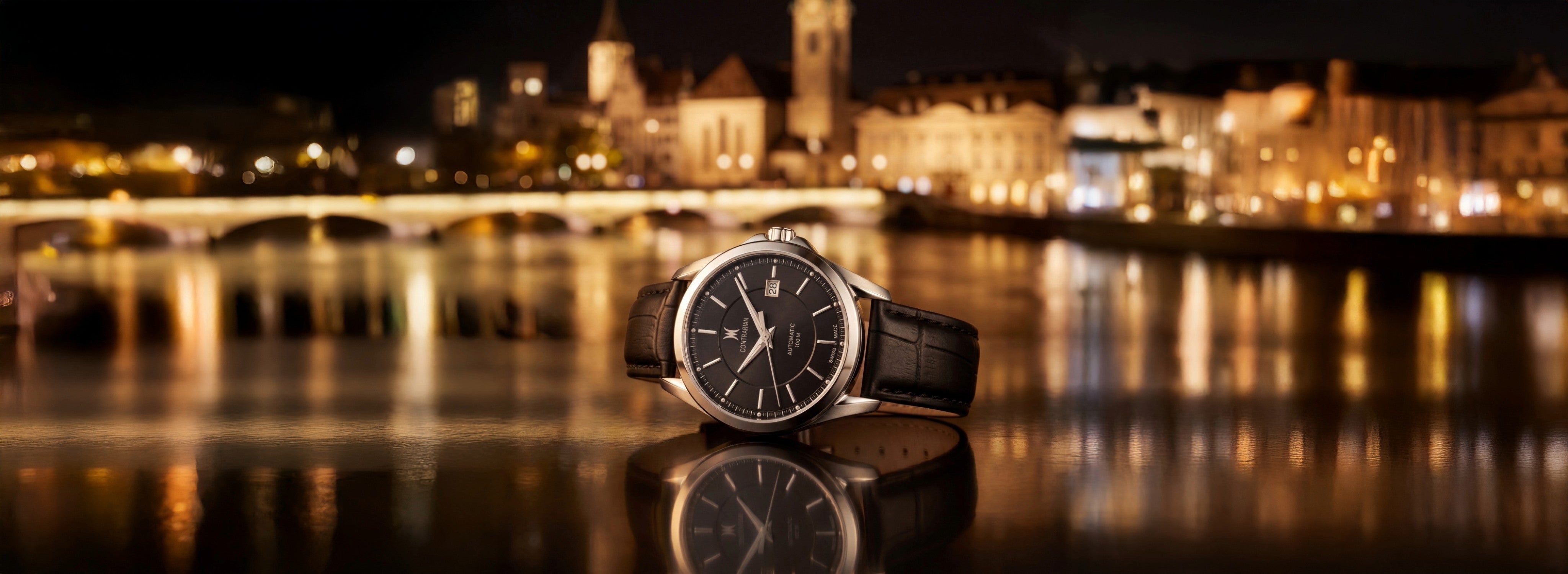Watch on a reflective surface with a cityscape in the background