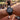 Person wearing a black watch with a blurred background of a race track