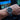 Close-up of a wrist wearing a watch with aviation instruments in the background